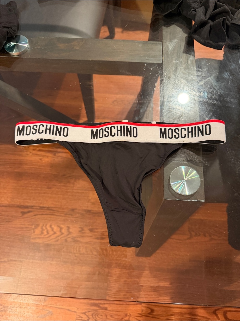 Moschino Black Thong with White Branded Waistband and Red Accent can be swimwear